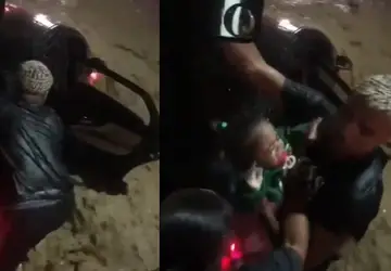 Homem resgata mulher e crianças presas dentro de carro em meio a correnteza 